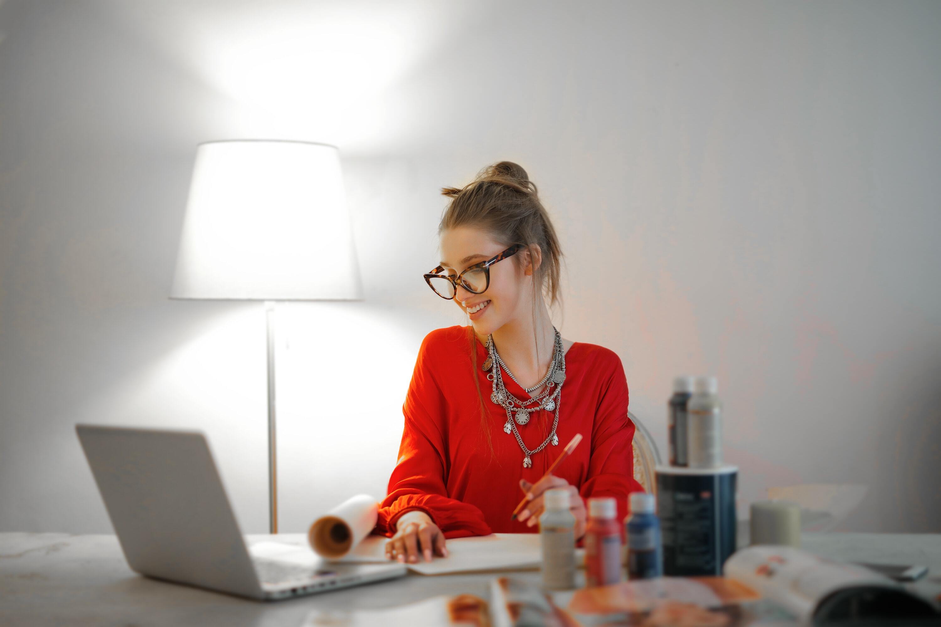 Woman In Red Long Sleeve Shirt Looking At Her Laptop 3765132